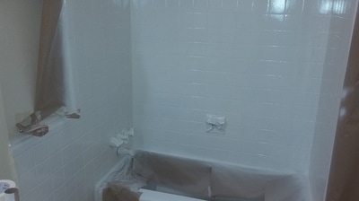 Tile in process of being changed to white and the grout lines are being sealed.