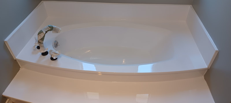 Cultured marble bathtub after being refinished by Dallas bathtub refinishing services in Dallas TX
