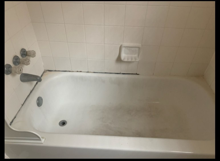The surface on this bathtub was worn down and discolored before being refinished by Dallas bathtub refinishing services